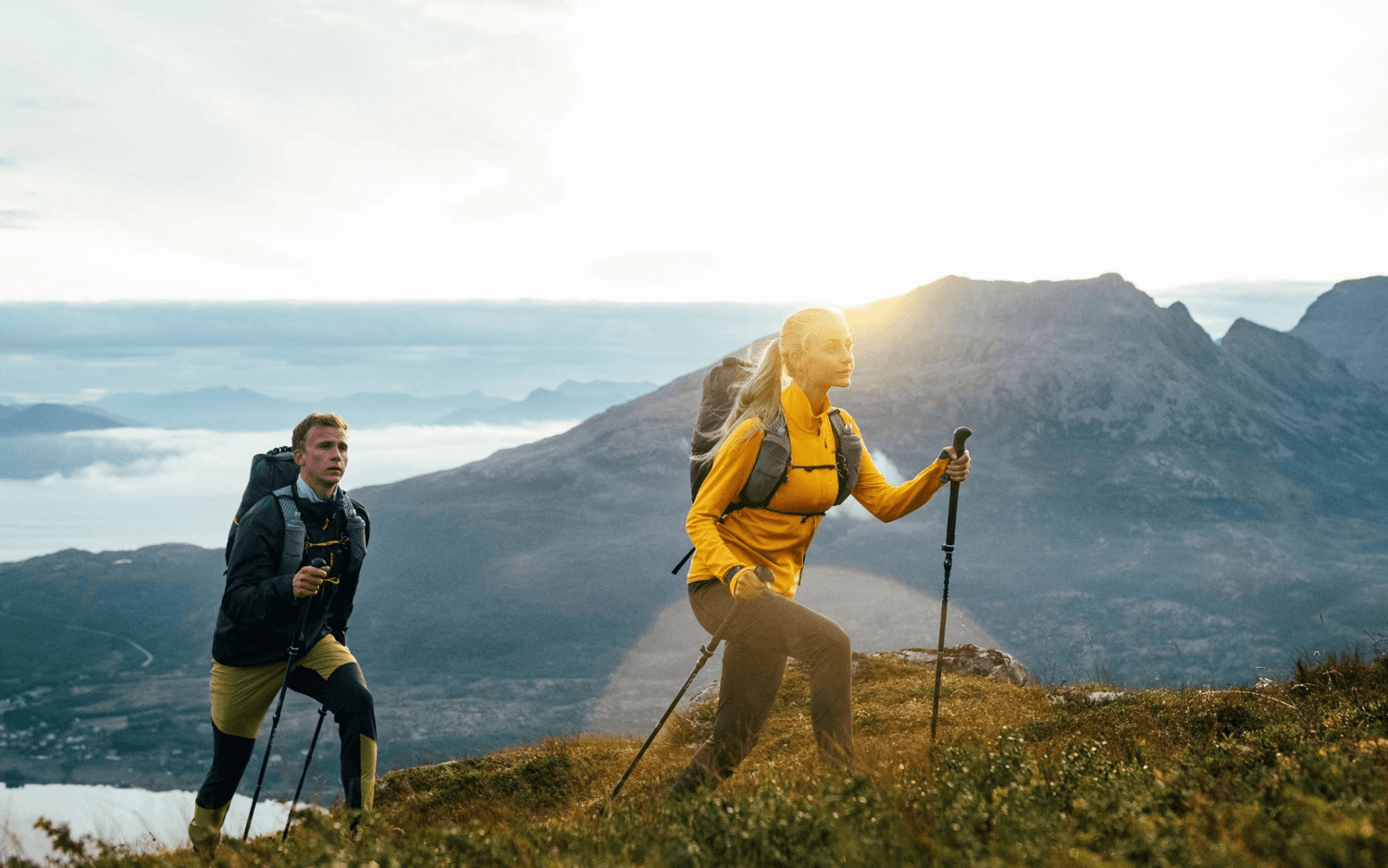 Hikers with trekking poles enjoy stunning mountain views during their adventure. Hiking Accessories - Adventure Gear From Global Trekker.